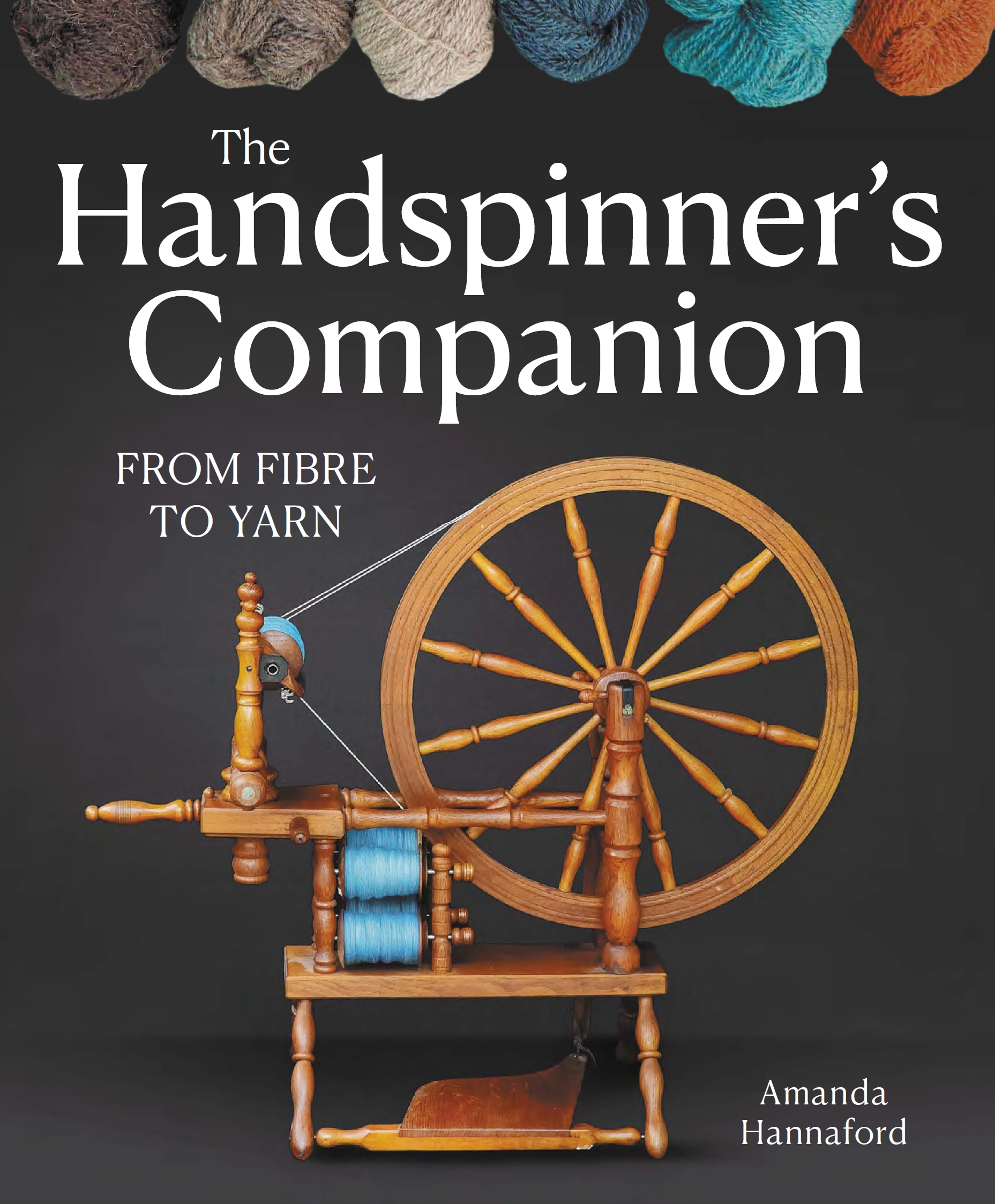 The front cover of the book - a photograph of a spinning wheel against a dark background